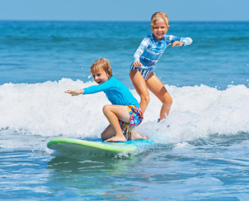 Kids surfing on Anna Maria Island