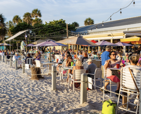 Diners eating outside at an Anna Maria Island beach restaurant