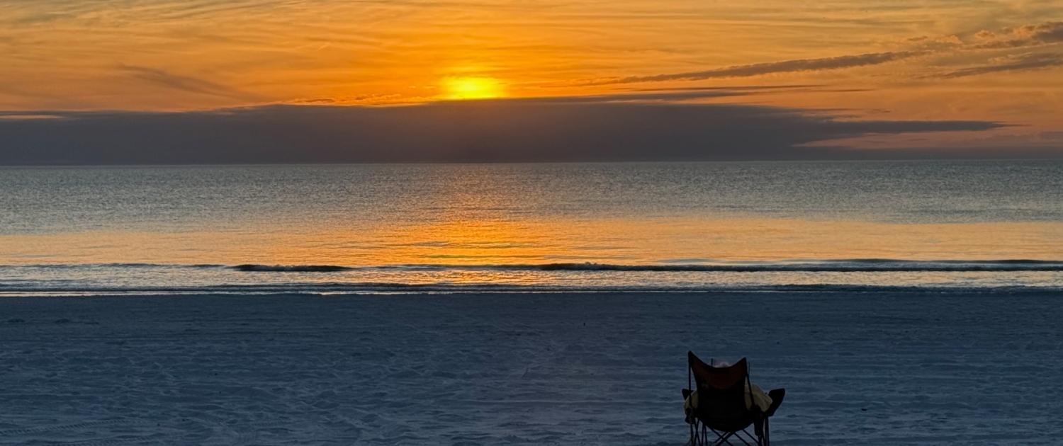 relaxing and watching the sunset on a beach on Anna Maria Island